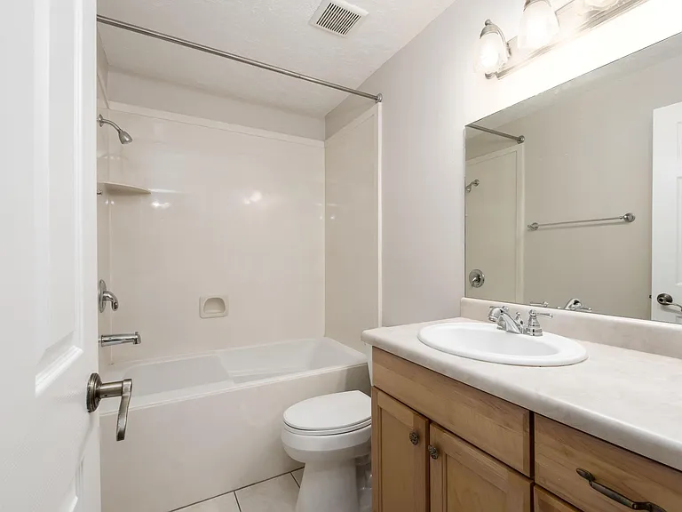 Master bath with a deep soaking tub.