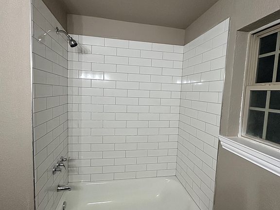 Hall bathroom - new tub, shower surround, flooring, paint, vanity and sinks.