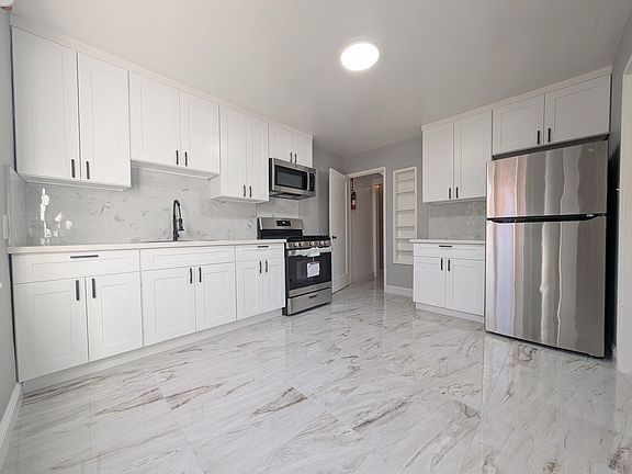 Newly remodeled kitchen. Brand new flooring, cabinets, and appliances