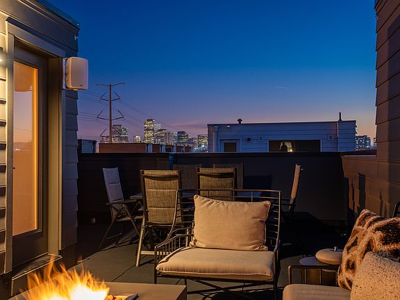 Rooftop deck with city and mountain views. Firepit in picture is included for the renter along with a grill.