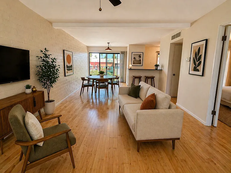 Spacious great room with floor to ceiling glass doors.