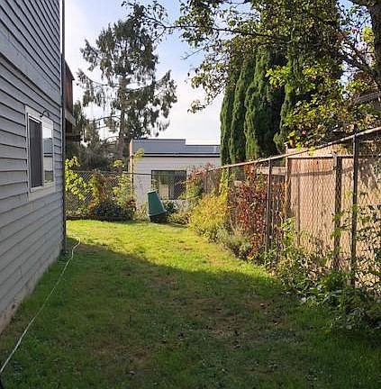 Side yard and more around the corner.