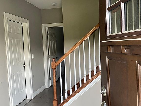 First floor entry. The garage is located to the left. Straight back the hallway leads to the family room and a full bathroom.