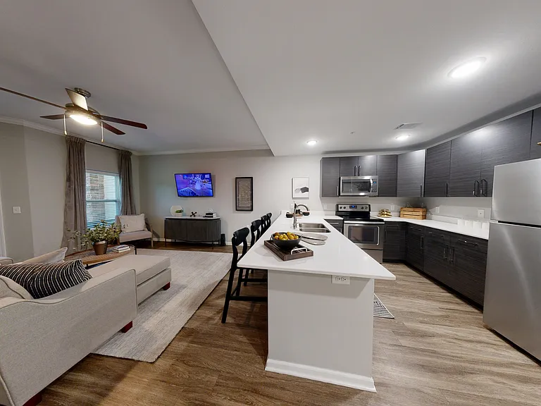 The Dogwood features an open-concept layout with a breakfast bar and large living room space. The Dogwood features an open-concept layout with a breakfast bar and large living room space.