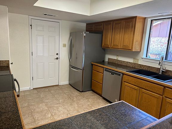 Kitchen with granite countertops and stainless steel appliances