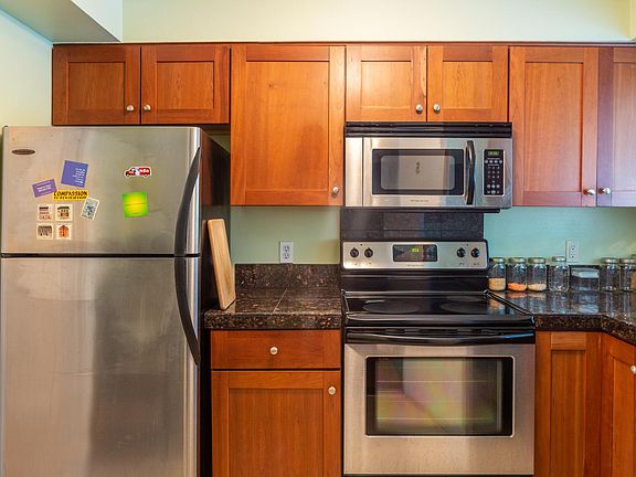 Kitchen w/ SS appliances and kitchenware