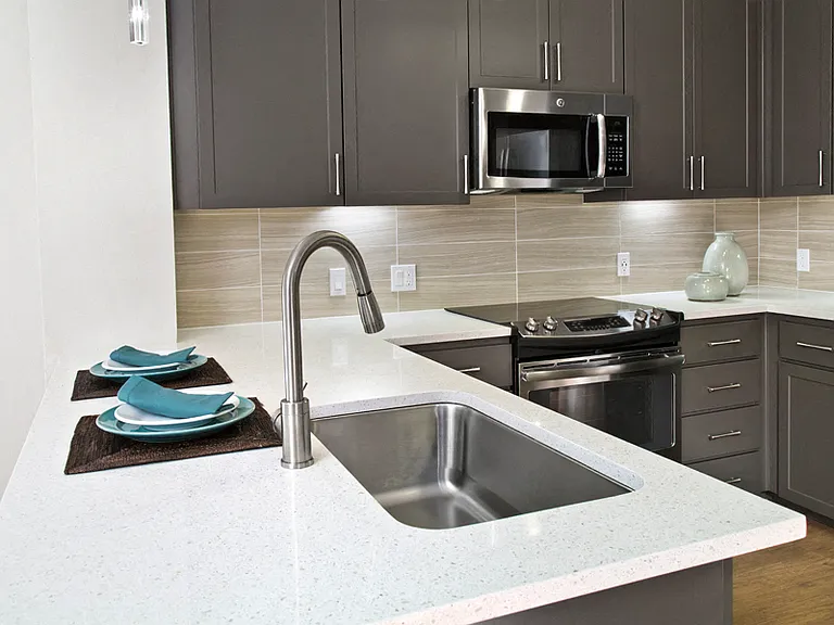 Gray custom cabinetry with undercabinet lighting