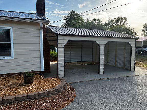 2 car carport somewhat enclosed