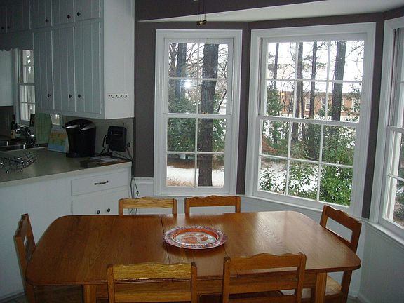 Kitchen Table area with bay window overlooking backyard