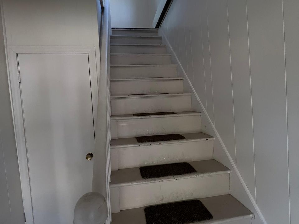 Entry stairs mudroom/storage area and closet