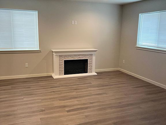 Living Room features electric fireplace and hardwood flooring