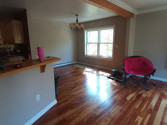 2025, dining area, viewed from living room, kitchen on left, and master bedroom further left