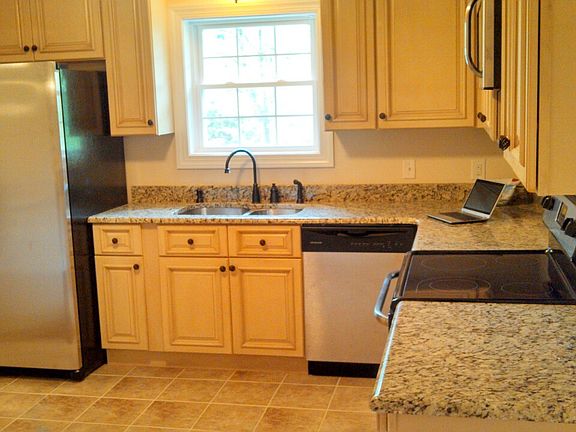Granite, tile, stainless, and custom cabinets