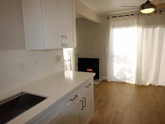 Kitchen with dining area and fireplace.