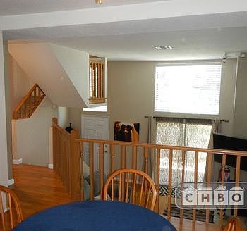 View from Dinette over living room, entry way and stairs ups