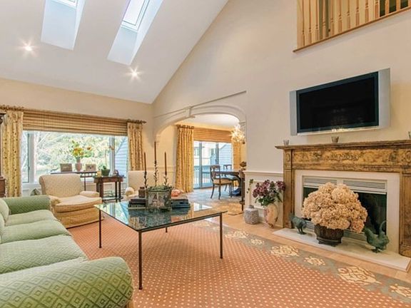 Sun filled riving room with a fire place