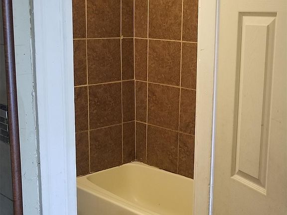 Bathroom with Custom Tiled Tub Surround and Floor