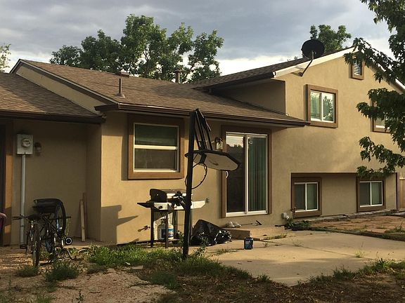 Back of house. The garage opens at the back for drive through to pad
