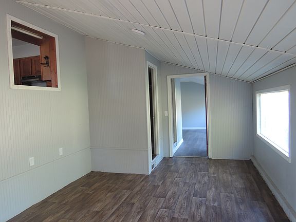 First of the two bedrooms down a short flight of stairs from the kitchen