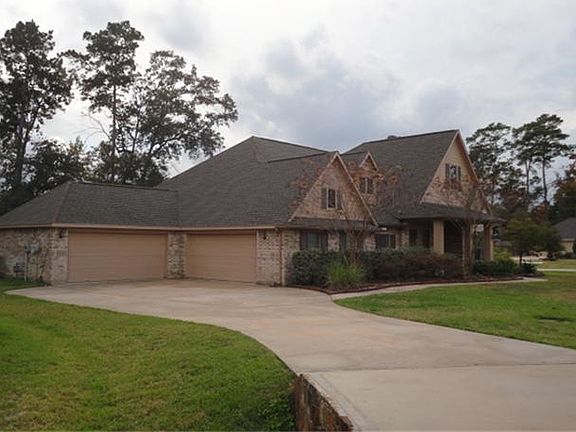 Sitting on a 1/2 acre, corner lot, this home has 4 garages.