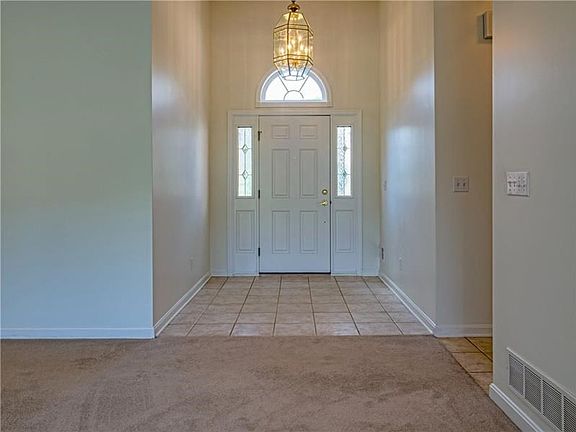 Enter the spacious two story foyer with sunlight flooding the home.