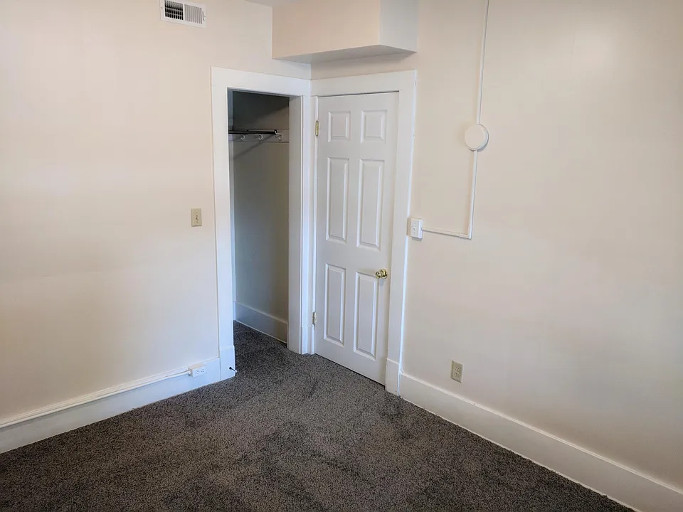 Bedroom 1 and view of closet.