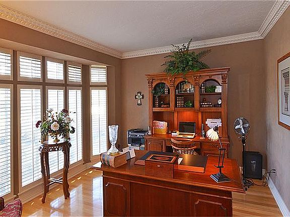 As you do your work, you can enjoy the natural light through the floor to ceiling windows with plantation shutters.