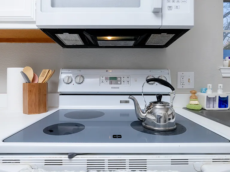 Fully stocked kitchen with ample counter space, stainless steel appliances, toaster, and kettle_everything you need to cook, snack, or sip in comfort.