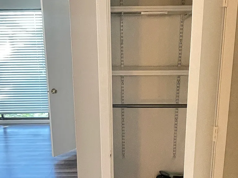 Entry way closet featuring shelving