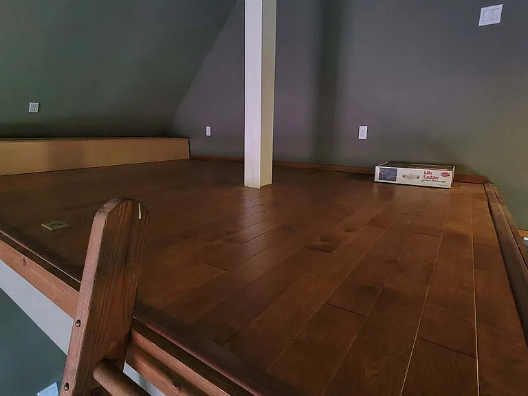 Loft - room for a queen bed and a dresser. Storage bin to the left of picture