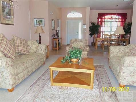Huge living room with sliding glass doors onto lanai