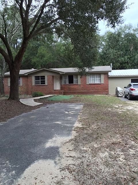 Front of duplex and parking pad