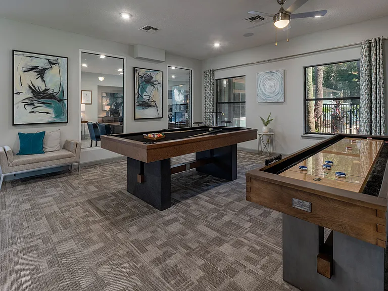 Clubhouse with pool and shuffleboard tables