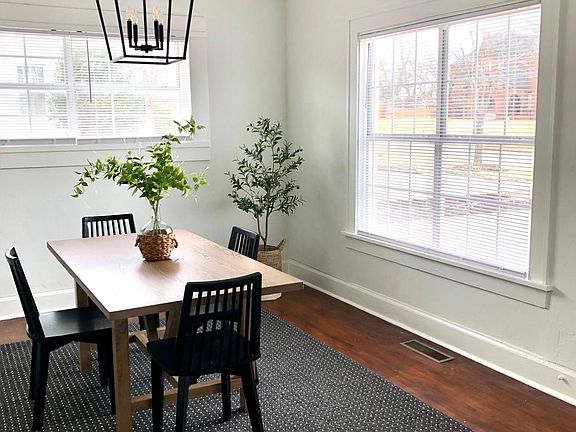 Tons of light flood the large furnished dining room!