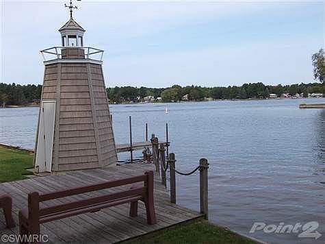 Lighthouse with light and storage at shore line