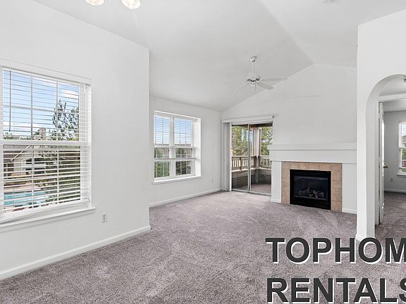 Combined LR with high ceiling and fireplace