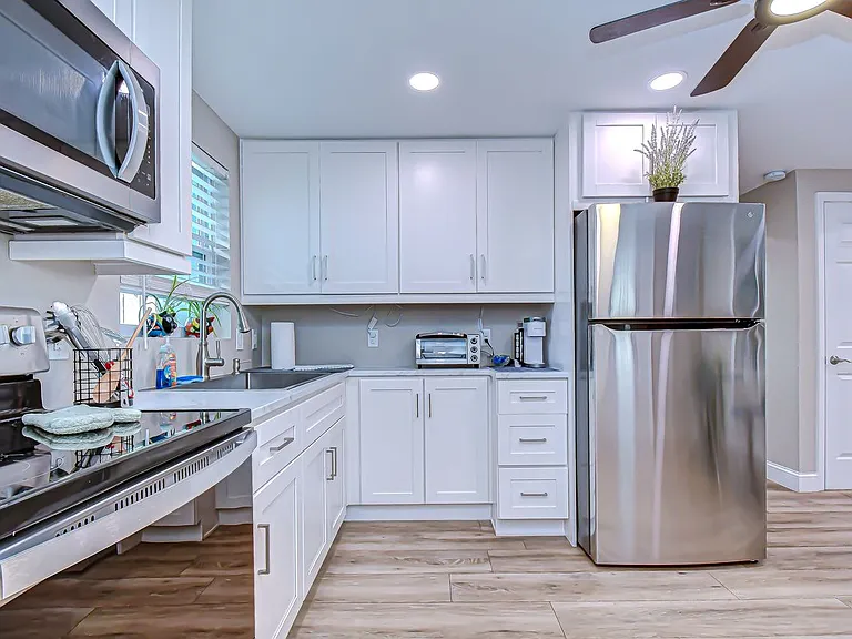 Fully stocked kitchen with stainless steel appliances