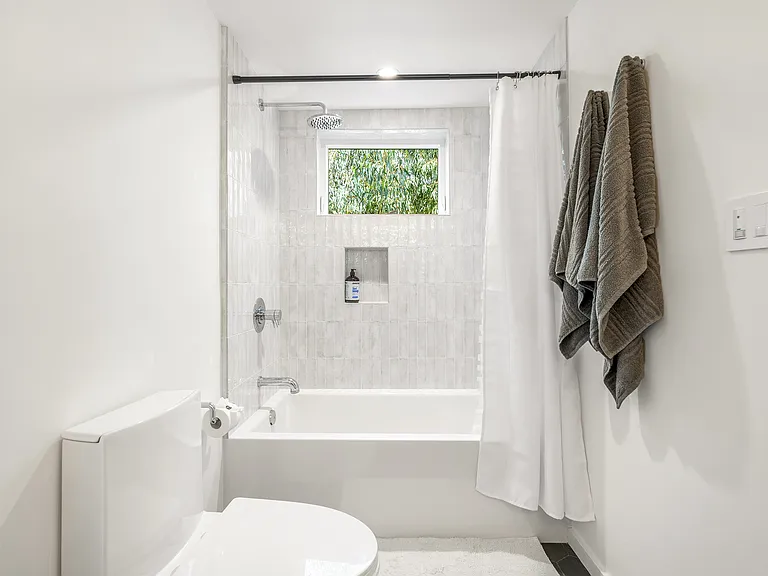 Unwind in style with this serene, well-appointed bathroom
