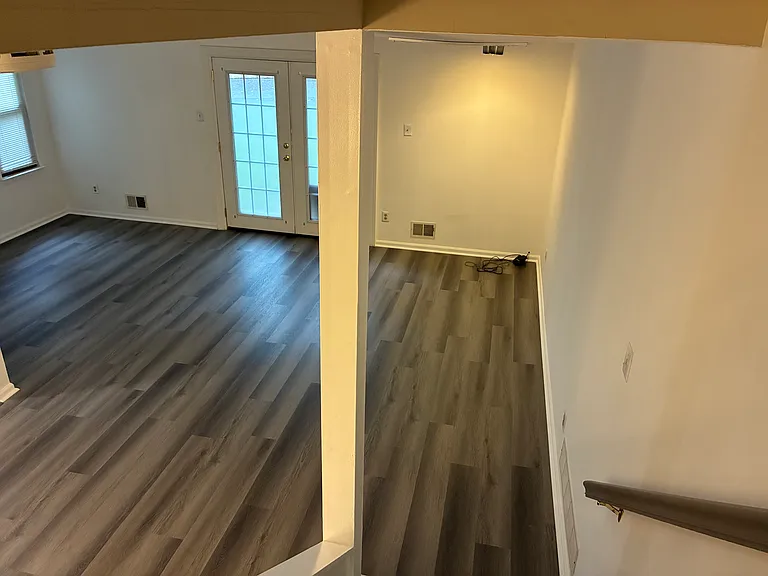 Dramatic View of Large Living Room with French Doors