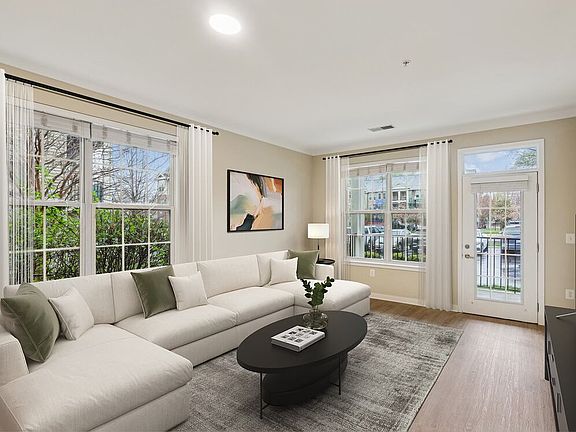 Renovated Package I living room with updated hard surface flooring