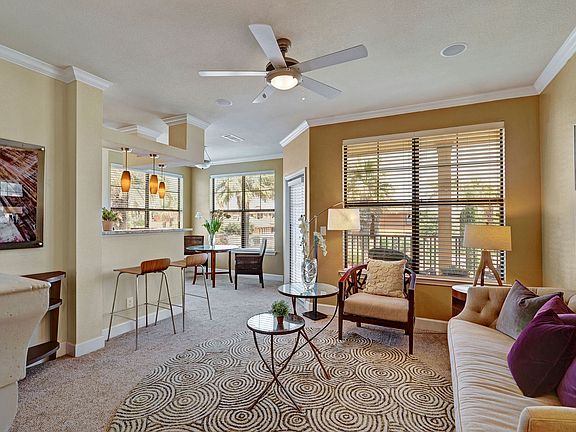 Tuscany Living Room with Floor to Ceiling Windows and Balcony