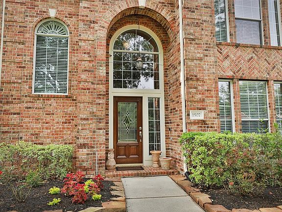 Freshly painted exterior and recently refinished front door for a sparkling clean look!