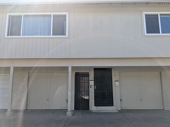 Downstairs gated entry and 2 separate 1-car garage for Apt 2