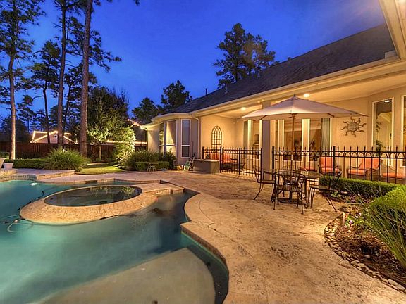  Outdoor fireplace AND outdoor kitchen with stainless Thermador grill & sink! Iron fence, French drains, sprinkler system, & manicured landscaping complete this unbelievale outdoor oasis!