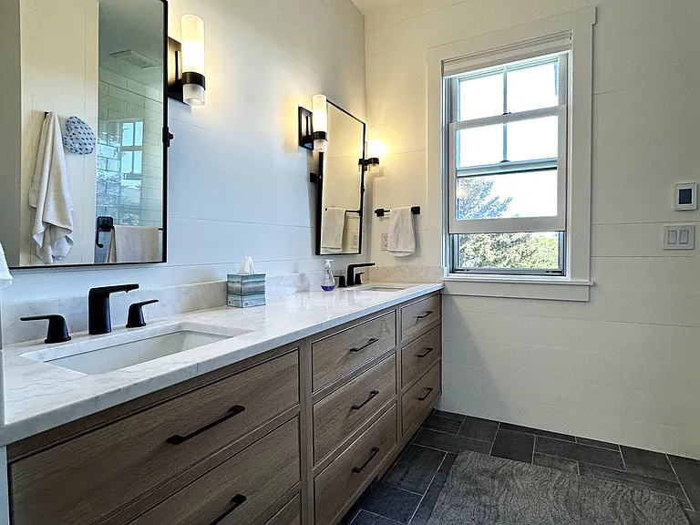 New master bath with dual sinks in the vanity, custom cabinetry, heated floors, and a walk-in shower for two with his & hers shower heads
