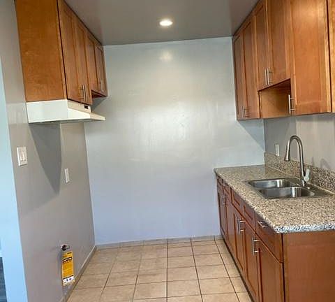 Kitchen On Left Wall would be Stove + Refrigerator next to back wall