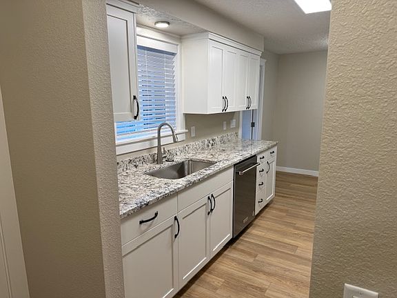 Brand New Kitchen with Stainless Steel Appliances and Granite Countertops.