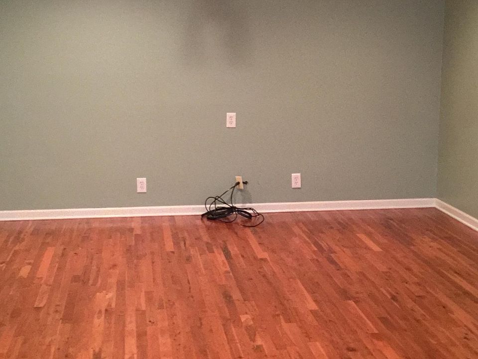 Large family room with newer hard wood flooring
