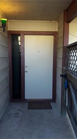 Front door behind gate.