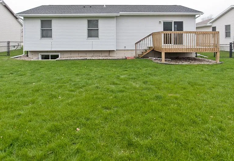 Relax in the large, fenced in backyard with deck